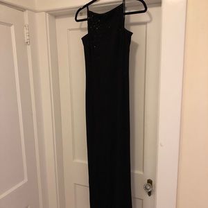 Long, black, dress, with sequins and open back.